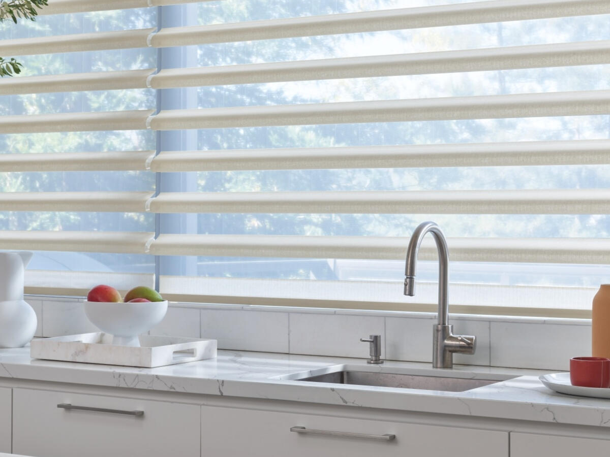 Pirouette® Window Shadings — sculpted fabric vanes that open onto a sheer backing. Hunter Douglas.
